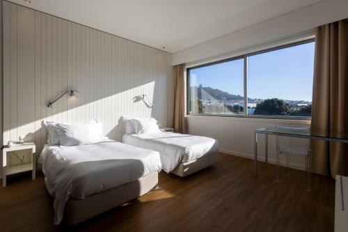 En eller flere senge i et værelse på Hotel Flor De Sal