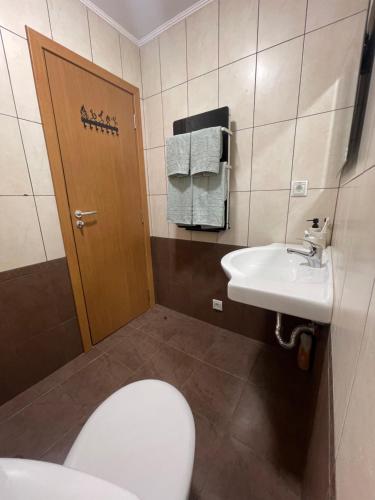 a bathroom with a toilet and a sink at Studio Béni in Smolyan