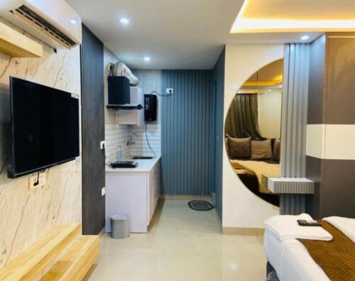 a small apartment with a kitchen and a living room at The Dreamlight Studio in Dehradun