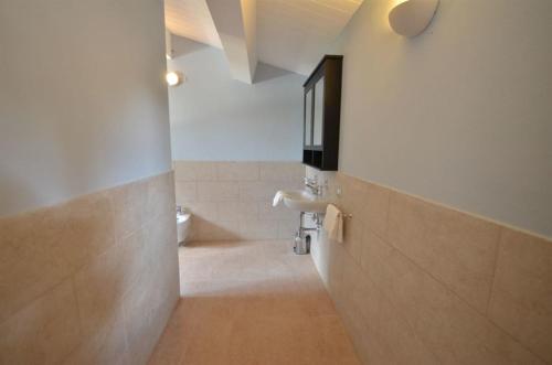 a bathroom with a sink and a toilet at Villa Cielo- Cignella Resort Tuscany Accommodation in Osteria Delle Noci