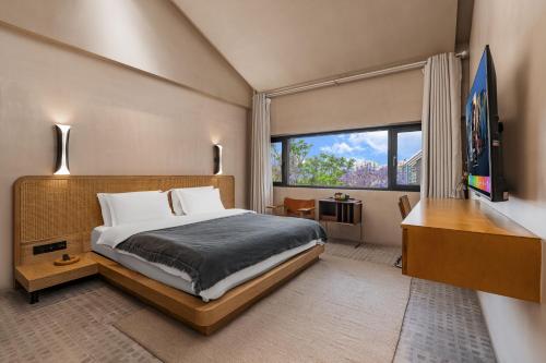 Vuode tai vuoteita majoituspaikassa Kunming Latosol hotel