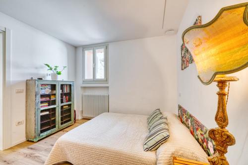 a bedroom with a bed and a mirror at Torretta In Centro Perugia in Perugia