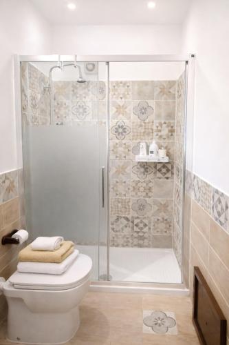 a bathroom with a shower and a toilet at A due passi dal Teatro Massimo in Palermo