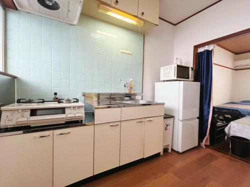 2号房 閑静な住宅街でご宿泊ください 天神博多巨蛋に直行するバスがあります
