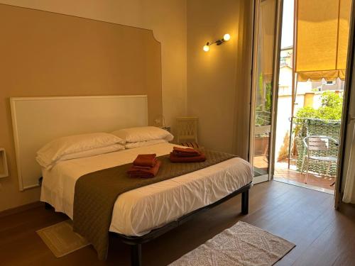 a bedroom with a bed with two towels on it at Residence Gloria in Montecatini Terme