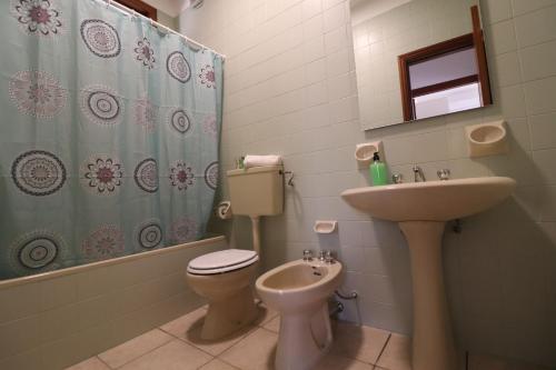 a bathroom with a toilet and a sink at Casa Giselle in Otranto in Otranto