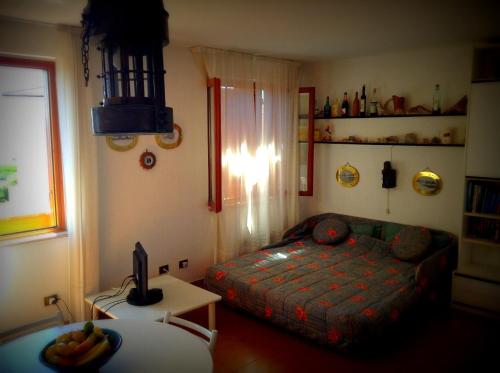 Appartamento La Maddalena tesisinde bir odada yatak veya yataklar