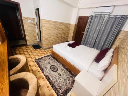 Vuode tai vuoteita majoituspaikassa Hotel Kandara