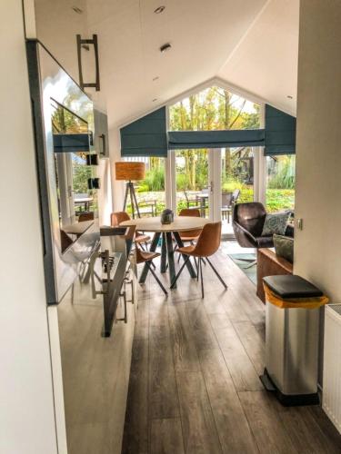 a dining room with a table and chairs at Beachhouse in Hulshorst