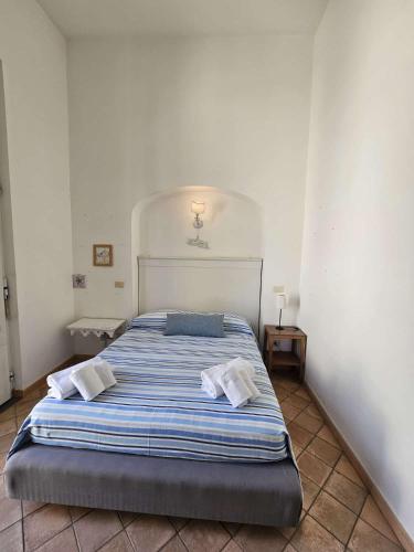 a bedroom with a bed with two pillows on it at Bell' Antonio Sea View in Minori
