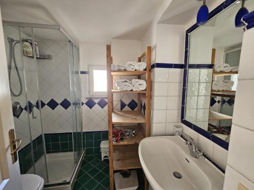 a bathroom with a tub and a shower and a sink at Bell' Antonio Sea View in Minori