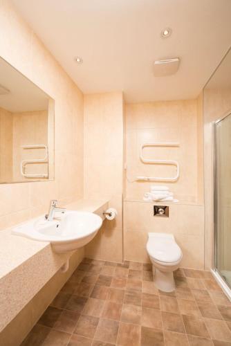 a bathroom with a sink and a toilet at Loch Tummel Hotel in Tummel Bridge