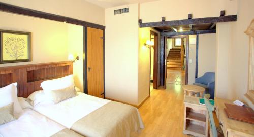 Ένα ή περισσότερα κρεβάτια σε δωμάτιο στο Hotel Kenia Nevada