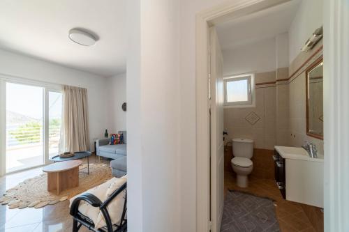 a bathroom with a sink and a toilet in a room at AQUA KALMA in Myrties