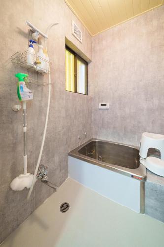 a bathroom with a sink and a toilet at Tachikawa City 3LDK Private House in Tachikawa