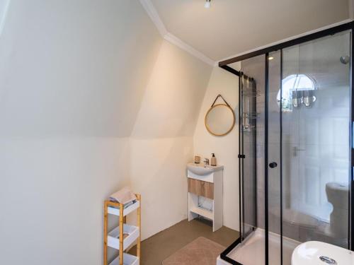 a bathroom with a shower and a sink at Five Elements Resort - Dome Glamping Tent in Harkerville