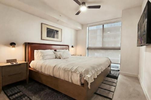a bedroom with a large bed and a window at Stylish Condo at The Crosby in Miami