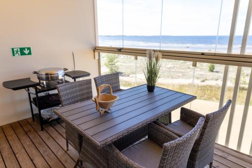 a dining room with a table and chairs at Marina Resort A9 in Kalajoki