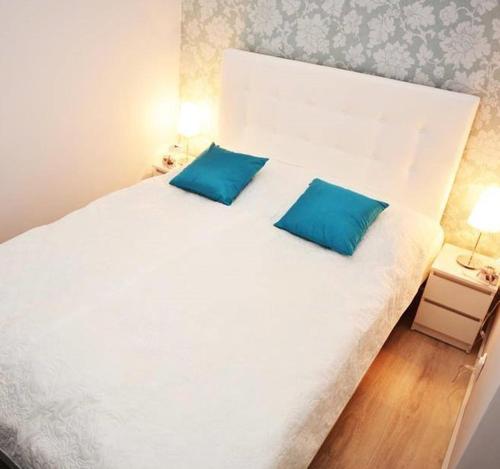 Posteľ alebo postele v izbe v ubytovaní Apartament Pod Kopernikiem