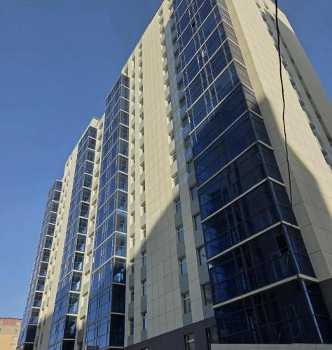 a tall building with a lot of windows at Zolu apartment in Ulaanbaatar