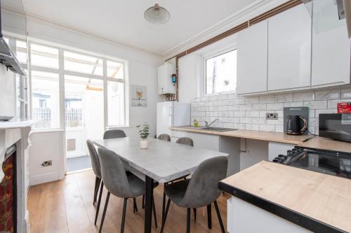 a kitchen with a table and chairs in it at The Haven Lodge in Gillingham