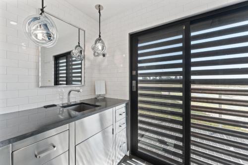 a kitchen with a sink and a window at Bodega Bay - Ocean View, Fireplace & BBQ in Bodega Bay