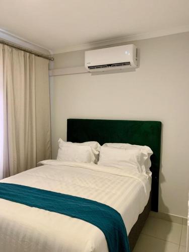 เตียงในห้องที่ Bouquet BnB