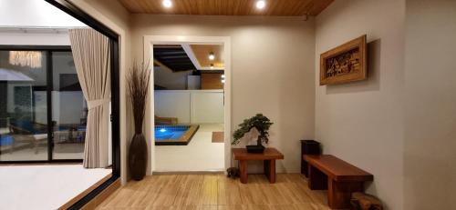 a living room with a bed and a window at Sila Thai Pool Villa3 in Ao Nang Beach