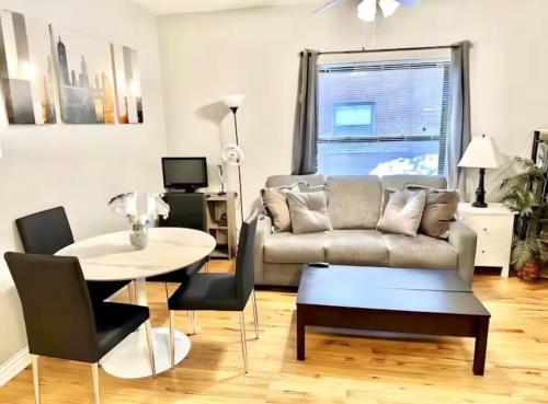 a living room with a couch and a table at Entire Apt in Heart of Chicago in Chicago