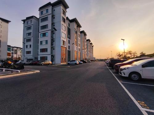 a street with cars parked in a parking lot at Homestay Naufal Bandar Sri Sendayan Ground Floor in Seremban