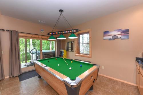 a living room with a pool table in it at Captains Quarters by Railey Vacations in Oakland