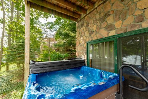 a hot tub outside of a house at Captains Quarters by Railey Vacations in Oakland
