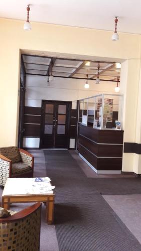 a lobby of a building with a door and a table at Dom Turysty in Kostrzyn nad Odrą