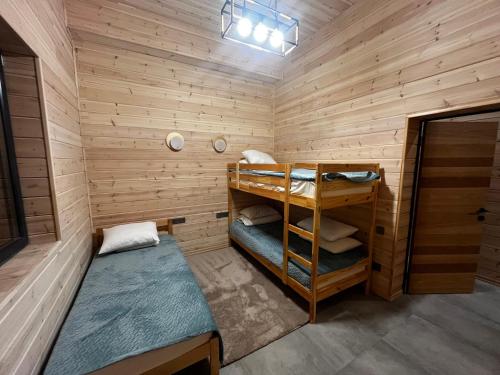 a small room with a bunk bed in a sauna at Chalet 1391 in Ryskulovo