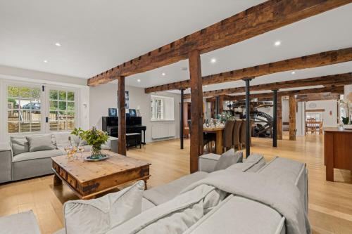 a living room with a couch and a table at Arlington Mill in Bibury