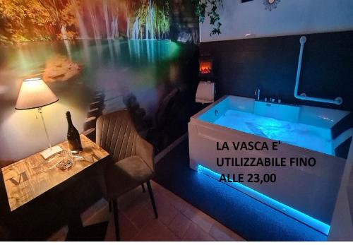 a jacuzzi tub in a room with a table at Taras Di San Vito Guest House in Taranto