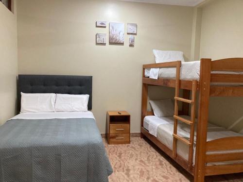 a bedroom with two bunk beds and a ladder at Sol de sauce - Casa Vacation Stay in Sauce