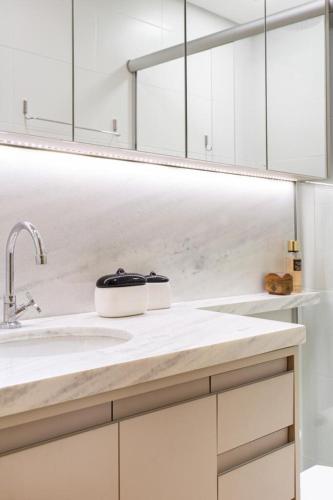 a kitchen with white cabinets and a sink at AP1011 Gray Eleven in Santa Maria