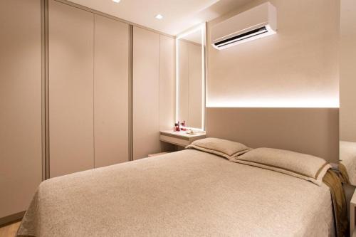 a bedroom with a large bed and a window at AP1011 Gray Eleven in Santa Maria