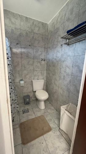 a bathroom with a toilet and a shower at Maximina Home in Comodoro Rivadavia