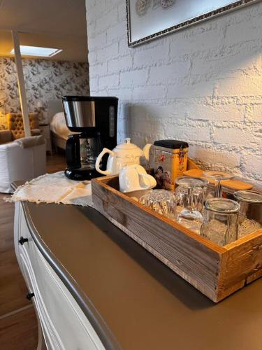 a counter with a coffee maker on top of it at De kleine Bongerd -The little Orchard in Hengelo