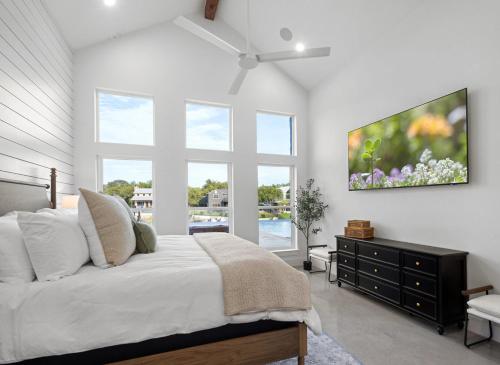 a bedroom with a bed and a large window at LBJ Retreat in Kingsland