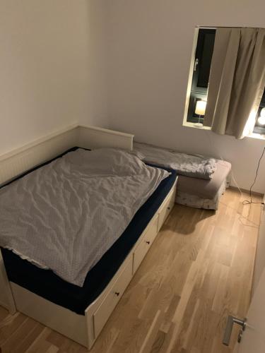 a small bedroom with a bed and a mirror at Private bedroom in Moss
