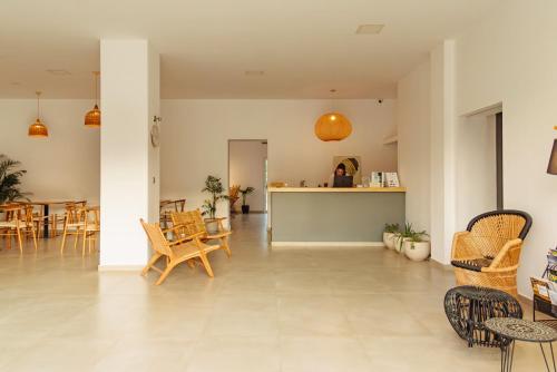 a living room with chairs and a table at BOHOTEL Messonghi - Designer's Hotel in Mesongi