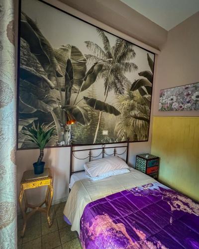 a bedroom with a bed and a painting on the wall at Hotel Continental Cassino in Cassino