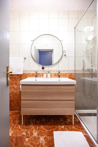 a bathroom with a sink and a mirror at Apartmani Vale 2 in Hvar