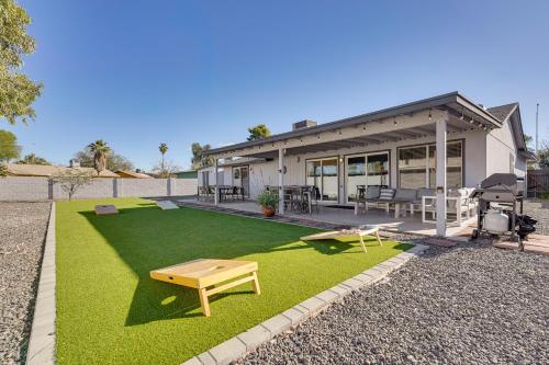 a house with a yard with green grass at Walk to Riverview Park! Dog-Friendly Mesa Retreat in Mesa