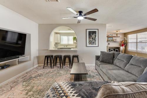 a living room with a couch and a flat screen tv at Walk to Riverview Park! Dog-Friendly Mesa Retreat in Mesa