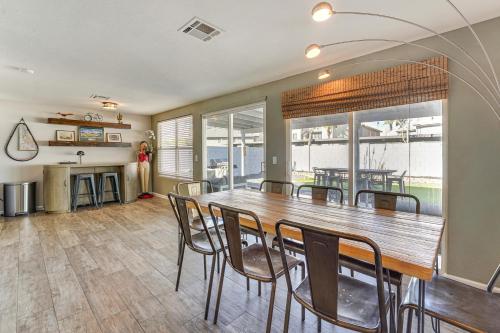 a dining room with a wooden table and chairs at Walk to Riverview Park! Dog-Friendly Mesa Retreat in Mesa