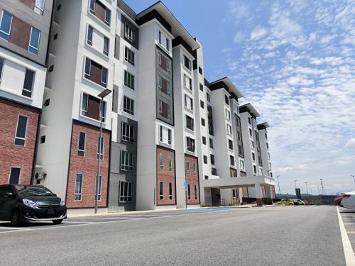 a car parked in front of a building at Homestay Naufal Bandar Sri Sendayan Ground Floor in Seremban